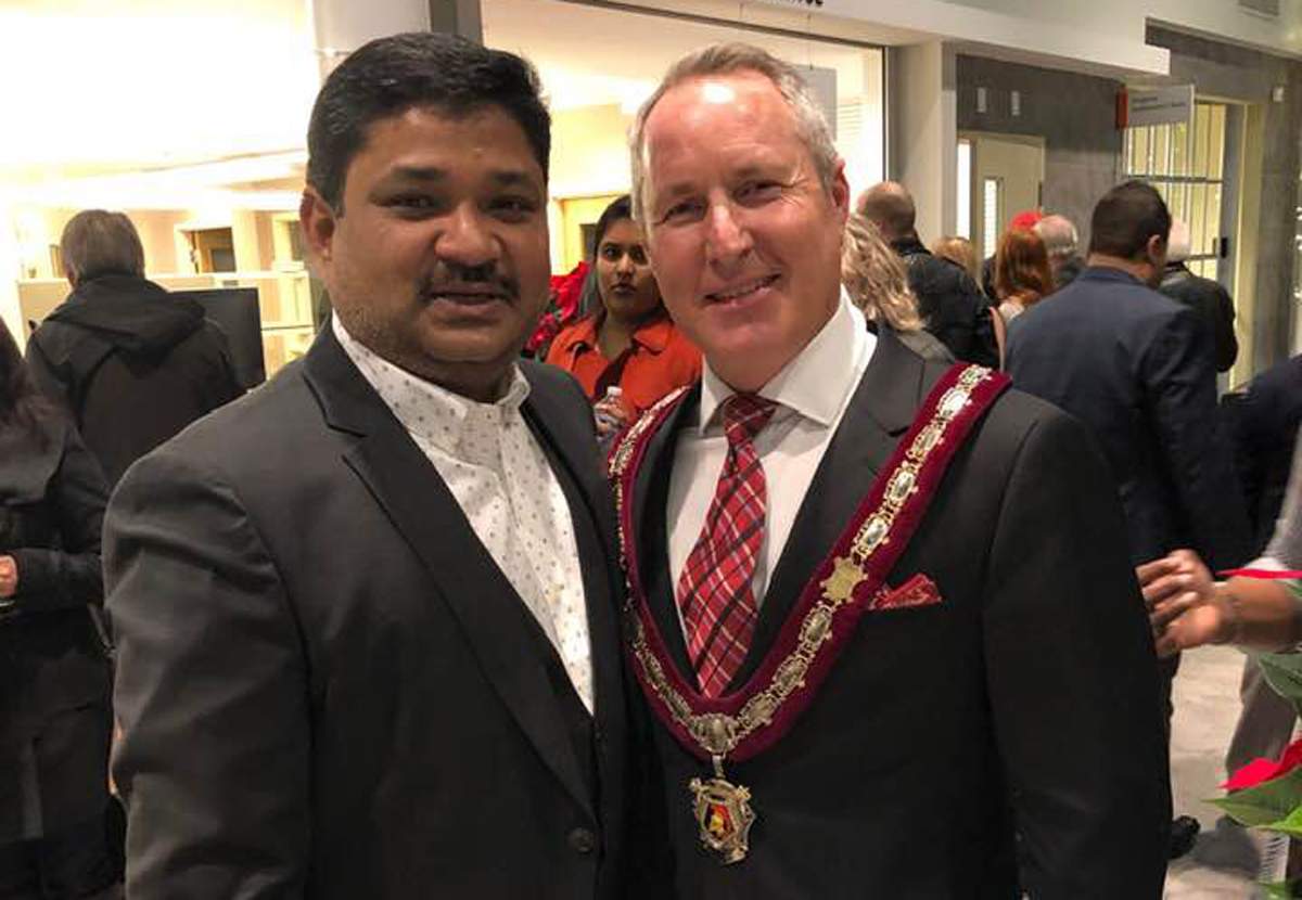 MD Tarekh Rana and Ajax Mayor Shaun Collier in an undated photo.