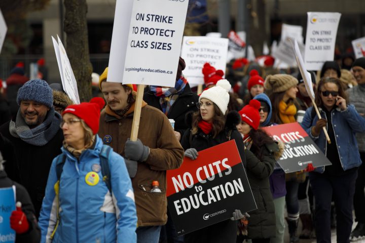 Striking teachers of the Ontario Secondary School Teachers Federation picket outside of the Toronto District School Board head office on Yonge St. in Toronto, Wednesday, Dec. 4, 2019.