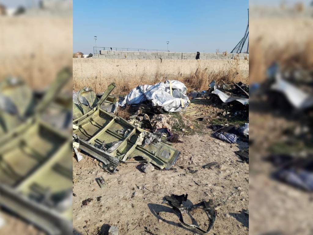 What appears to be one of the aircraft’s doors was part of the rubble.