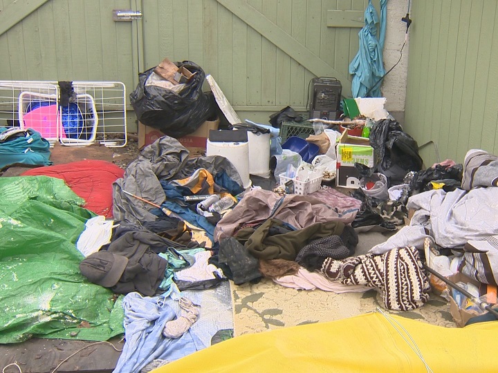 What was inside the make-shift lean-to in the backyard of Geraldine Mailloux’s property, after police peeled back the tarp on Thursday.