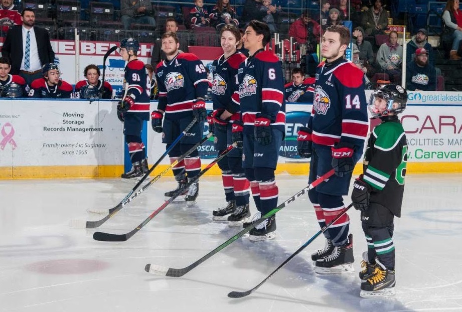 Mason Millman and Ryan Suzuki share a moment prior to puck drop.