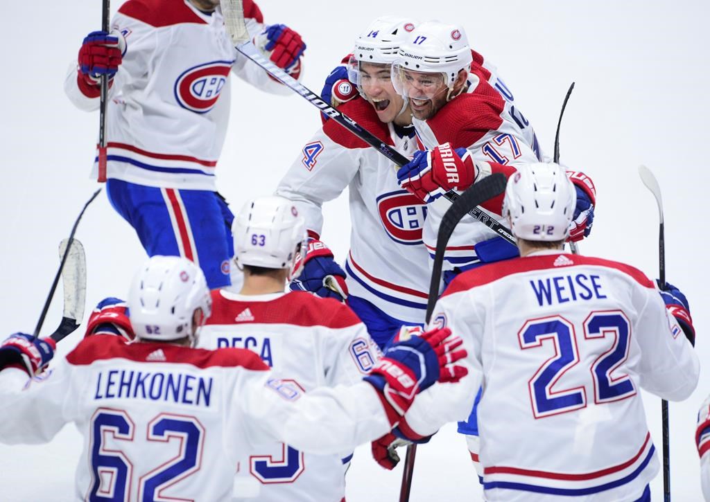 Montreal Canadiens left wing Ilya Kovalchuk (17) and teammate Nick Suzuki (14) celebrate their 2-1 win over the Ottawa Senators following NHL action in Ottawa on Saturday, Jan. 11, 2020.