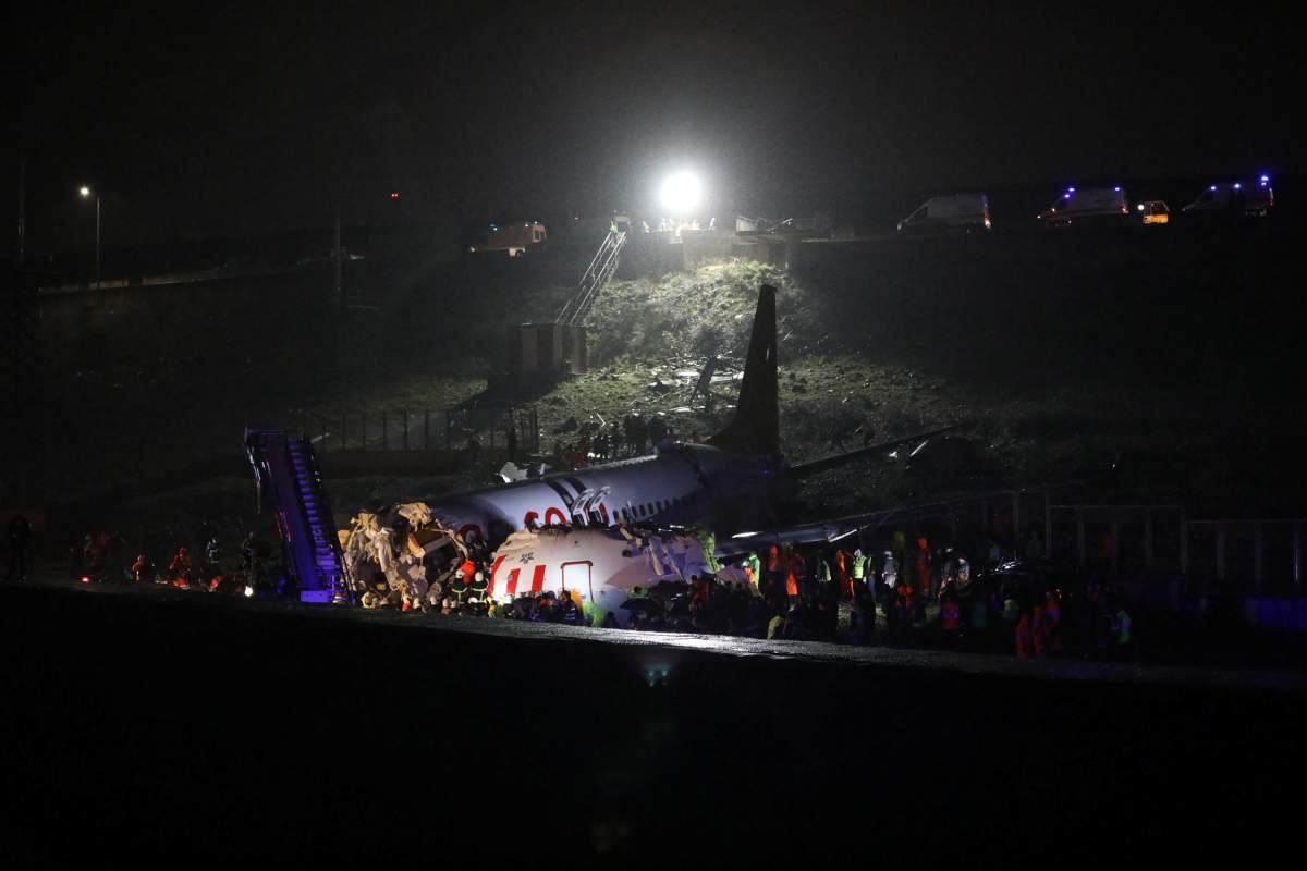 Firefighters and rescue teams are seen next to the wreckage of a plane after it crashed at Sabiha Gokcen airport in Istanbul, Turkey, Feb. 5, 2020.