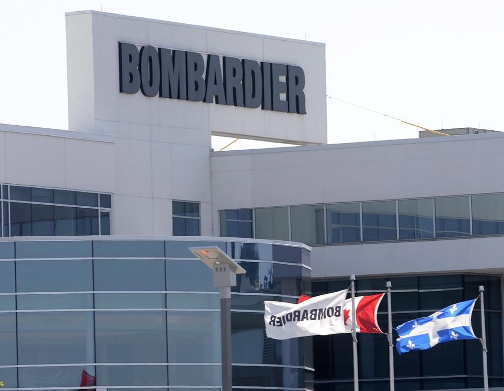 Flags fly outside a Bombardier plant in Montreal on May 14, 2015.