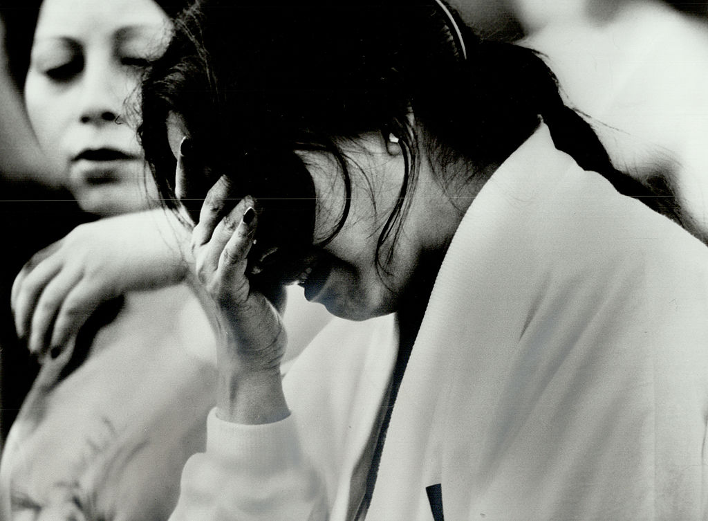 Mina Sarangi, the mother of Air India plane crash victim 14-year-old Rajashree Sarangi, cries during a memorial service in Nathan Phillips Square. (Photo by Jeff Goode/Toronto Star via Getty Images)