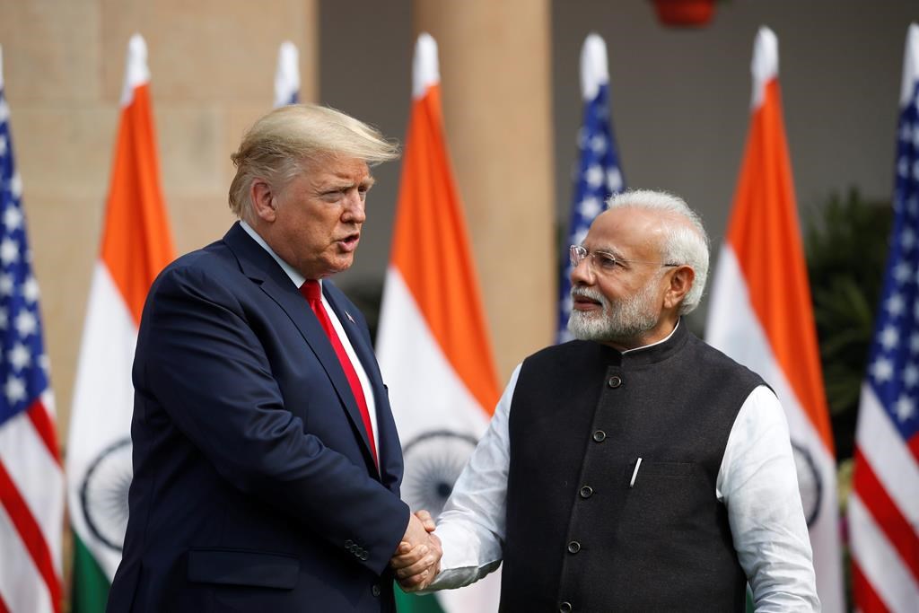 U.S. President Donald Trump and Indian Prime Minister Narendra Modi shake hands before their meeting at Hyderabad House in New Delhi, India, Tuesday, Feb. 25, 2020. (AP Photo/Alex Brandon)