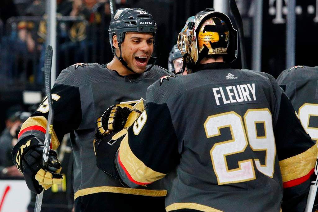 The Vegas Golden Knights’ Ryan Reaves, left, celebrates with goaltender Marc-Andre Fleury after defeating the Edmonton Oilers in an NHL hockey game Wednesday, Feb. 26, 2020, in Las Vegas. (AP Photo/John Locher)
