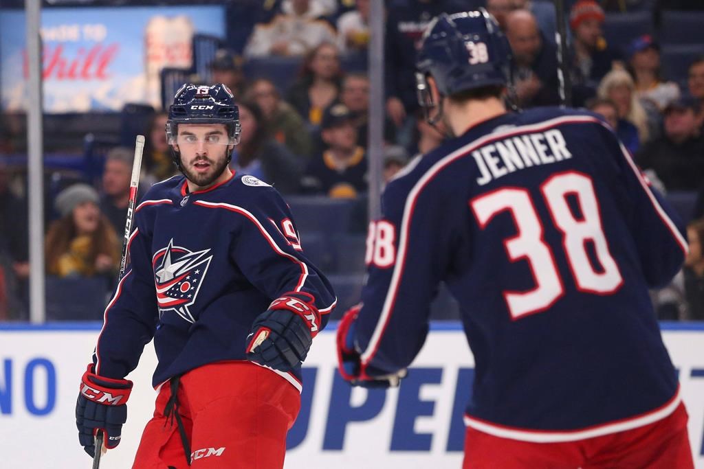 Columbus Blue Jackets forward Boone Jenner celebrates his goal with forward Liam Foudy against the Buffalo Sabres, Feb. 13, 2020, in Buffalo, N.Y.