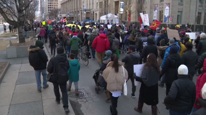 Demonstrators march down University Avenue on Saturday in solidarity with members of the Wet’suwet’en Nation who oppose the building of a pipeline through the nation’s unceded territory.