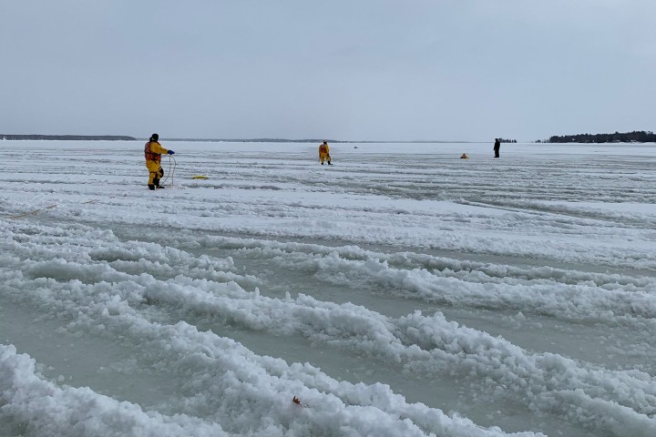Police say they arrived before other emergency services and helped the four individuals on three machines, who had driven into heavy slush and open water.