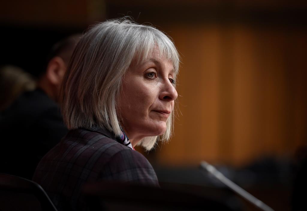 Minister of Health Patty Hajdu listens during a press conference on COVID-19 in West Block on Parliament Hill in Ottawa on Friday, March 20, 2020. THE CANADIAN PRESS/Justin Tang