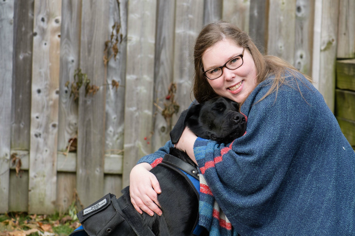 Sinead Zalitach pictured here with her service dog. Photo by Kristina Laukkanen