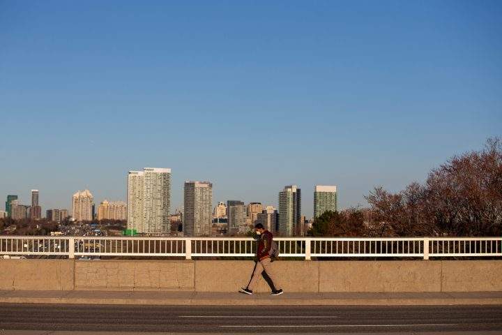 A man wears a mask while walking along Don Mills Road as the number of coronavirus disease (COVID-19) cases continue to grow in Toronto, Ontario, Canada April 6, 2020.