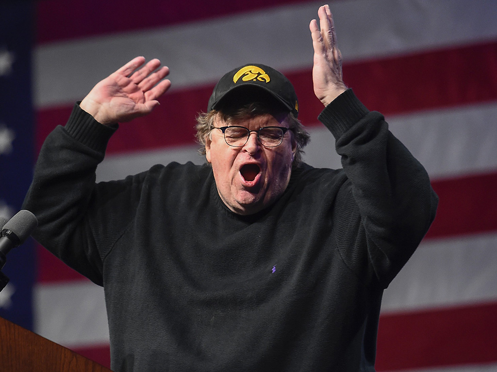 U.S. filmmaker Michael Moore addresses supporters of Senator Bernie Sanders at the Bernie 2020 Caucus Concert at Horizon Events Center in Clive, Iowa, on Jan. 31, 2020. 