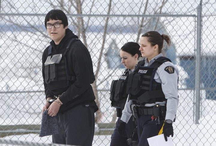 Randan Dakota Fontaine is led out of court in La Loche, Sask. on Friday, Feb.23, 2018 after a provincial court judge decided that he would be sentenced as an adult in the 2016 shooting spree that left four people dead and seven others wounded in La Loche. 