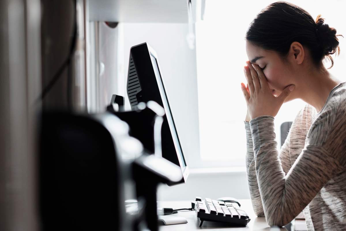 Hispanic woman using computer.