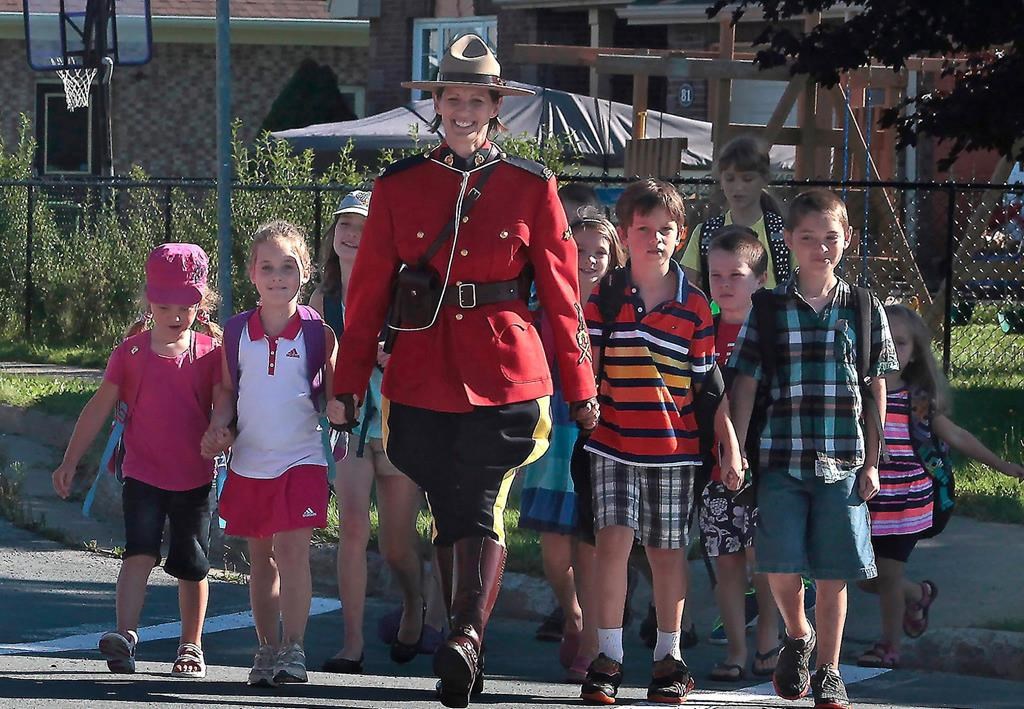 RCMP Const. Heidi Stevenson is shown with children in an undated photo.