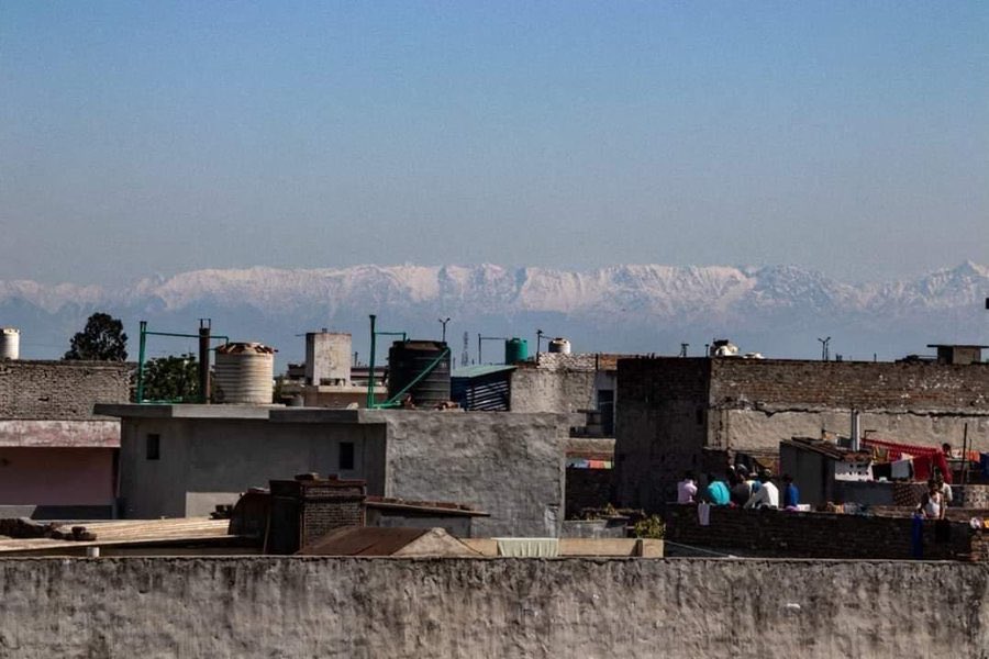 The Himalayas are shown in the distance from Jalandhar in the Indian state of Punjab on April 3, 2020.