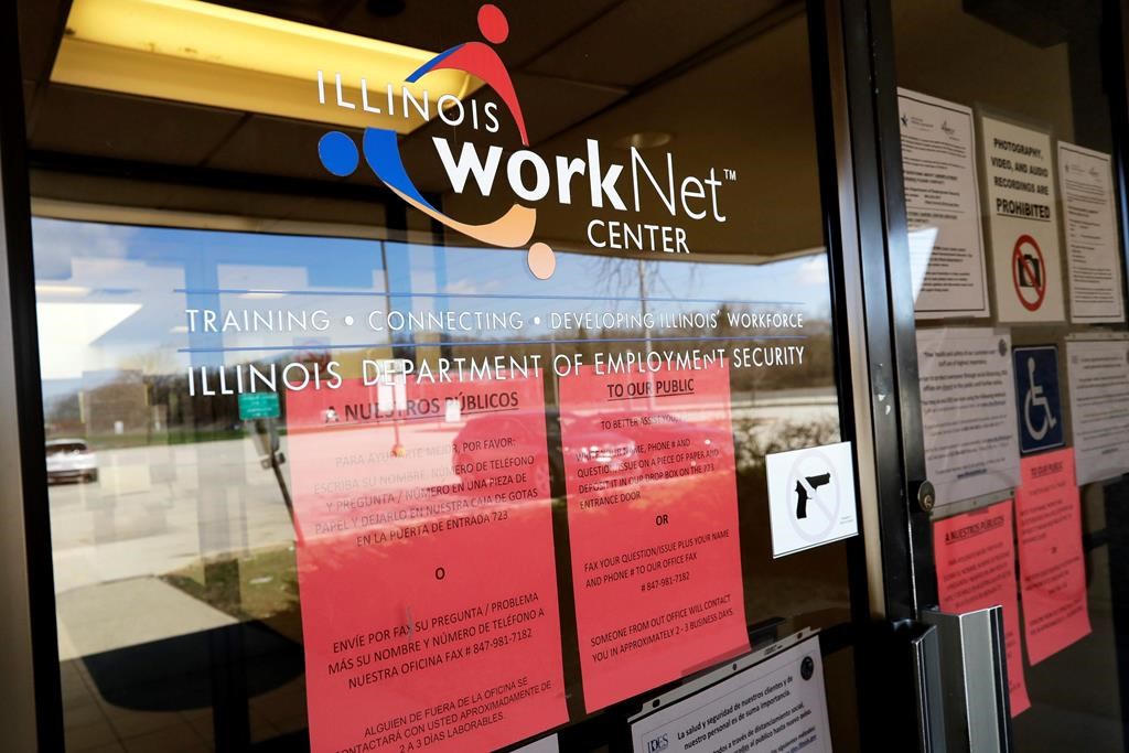 Information papers display at IDES (Illinois Department of Employment Security) WorkNet center in Arlington Heights, Ill., Thursday, April 9, 2020. Another 6.6 million people filed for unemployment benefits last week, according to the US Department of Labor, as American workers continue to suffer from devastating job losses, furloughs and reduced hours during the coronavirus pandemic. (AP Photo/Nam Y. Huh).