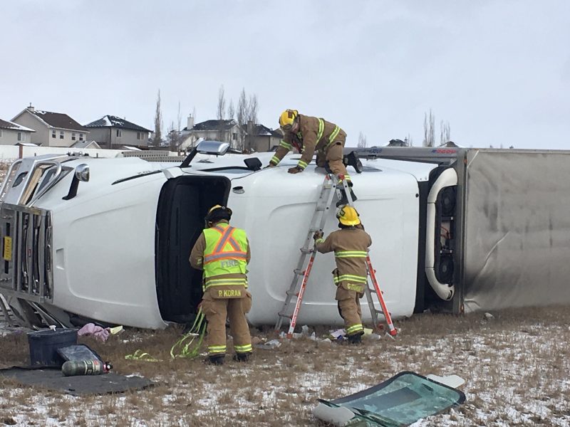Calgary firefighters respond to a rollover on Stoney Trail Northwest on Wednesday, April 1, 2020