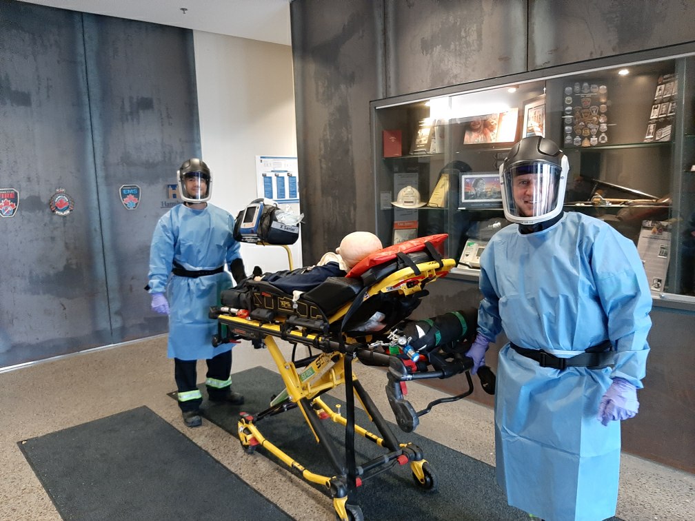 A pair of Hamilton paramedics who are part of an infectious disease team dawn powered air purifying respirators as part of personal protection equipment the 12 member group will wear when caring for patients connected to the new coronavirus.