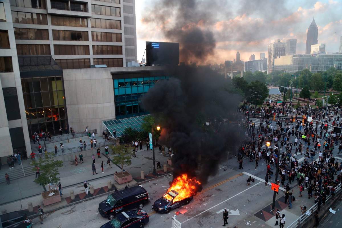 George Floyd death: Protesters confront police outside CNN headquarters in Atlanta - image