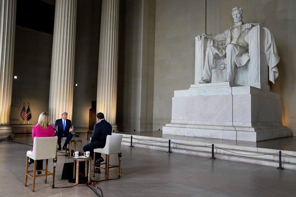President Donald Trump speaks during a Fox News virtual town hall from the Lincoln Memorial, Sunday, May 3, 2020, in Washington, co-moderated by FOX News anchors Bret Baier and Martha MacCallum. (AP Photo/Evan Vucci)