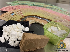 Police said they seized cash and illicit drugs when they searched a Kelowna home on Wednesday. 