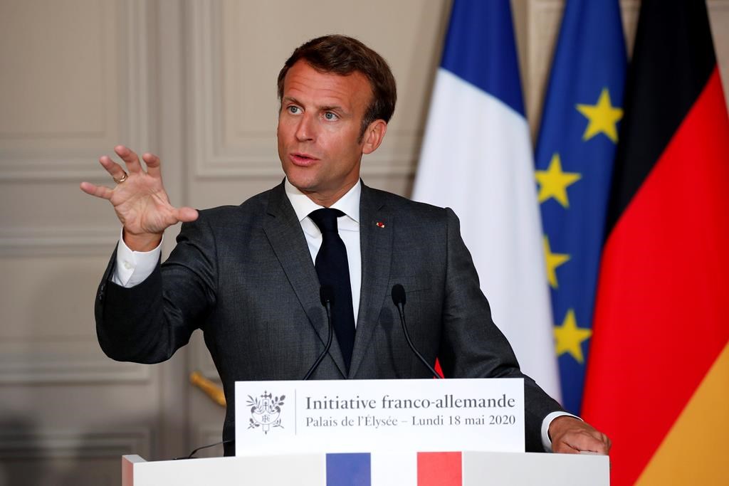 French President Emmanuel Macron speaks during a joint video press conference with German Chancellor Angela Merkel at the Elysee Palace Monday, May 18, 2020 in Paris. France and Germany discussed Europe’s economic recovery plans to respond to the virus crisis.