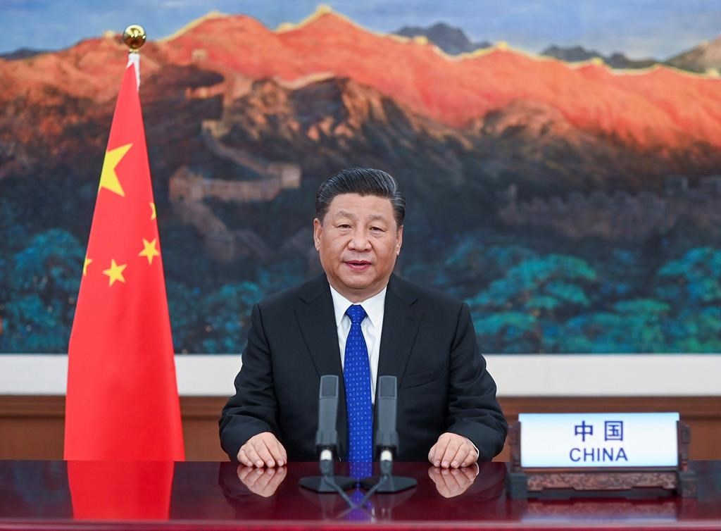 In this photo released by Xinhua News Agency, Chinese President Xi Jinping delivers a speech at the opening of the 73rd World Health Assembly via video link in Beijing, Monday, May 18, 2020. China on Monday announced it will give $2 billion to the fight against the coronavirus. As nations carved out a new normal amid the pandemic, Chinese President Xi Jinping told the World Health Organization's annual meeting Monday that the funds would be paid out over two years to help respond to COVID-19, which has already killed hundreds of thousands and devastated national economies. (Li Xueren/Xinhua via AP).