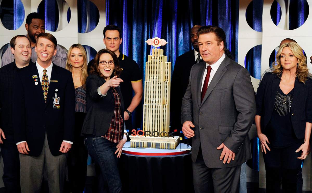 Cast members from ’30 Rock,’ including (front row from left) Jack McBrayer, Tina Fey, Alec Baldwin and Jane Krakowski, celebrate the 100th episode taping of the show at Silver Cup Studios on March 10, 2011 in New York City.