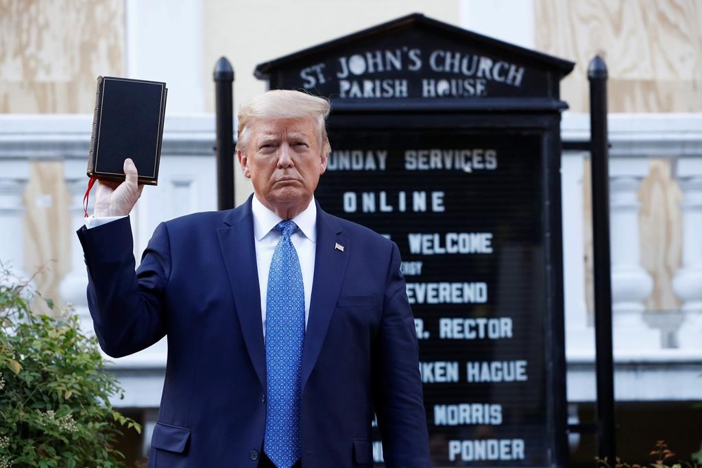 President Donald Trump holds a Bible as he visits outside St. John\’s Church across Lafayette Park from the White House Monday, June 1, 2020, in Washington. Park of the church was set on fire during protests on Sunday night.