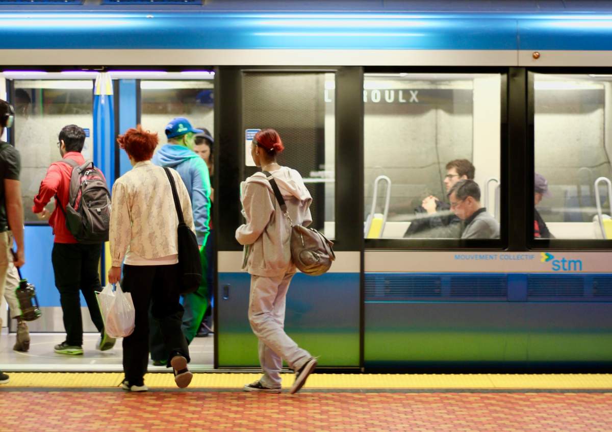 Passengers board a train on the Montreal métro at Lionel-Groulx station in the city's Sud-Ouest borough. The transit agency says it will not pay a ransom following an Oct. 19, 2020 cyberattack.