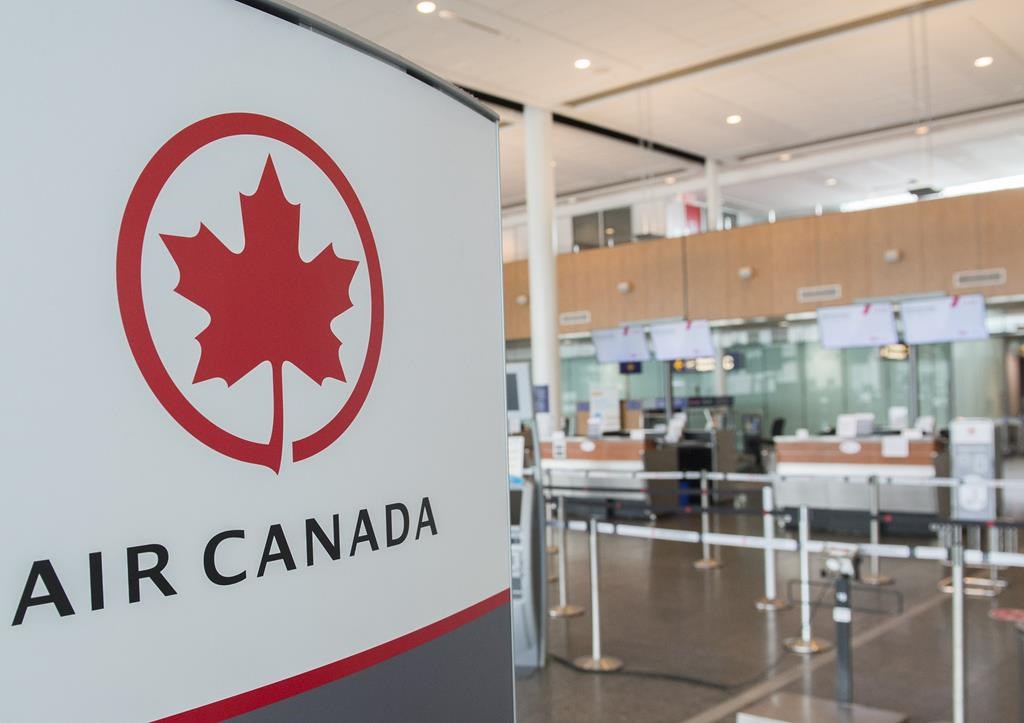 An Air Canada check-in area is shown at Montreal-Pierre Elliott Trudeau International Airport, Saturday, May 16, 2020.
