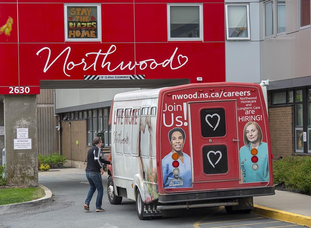 A driver enters a shuttle bus at Northwood Manor, one of the largest nursing homes in Atlantic Canada, in Halifax on Tuesday, June 2, 2020.