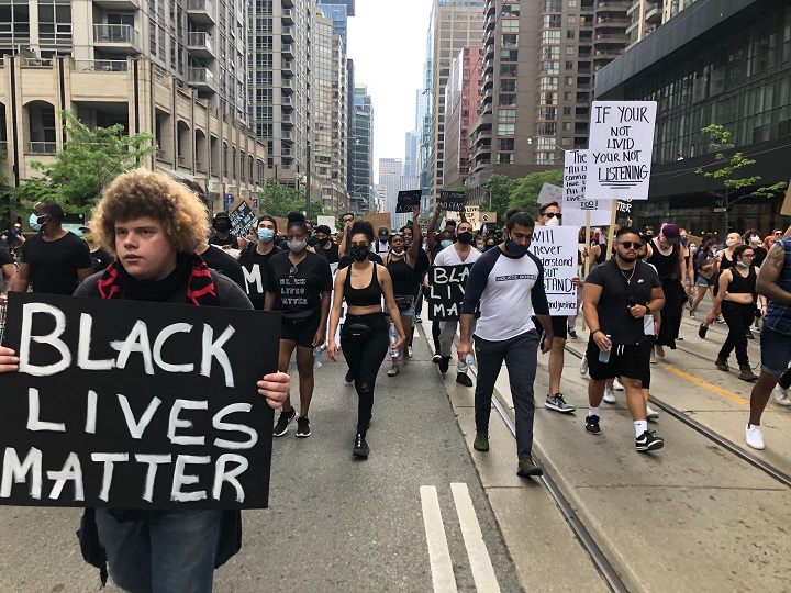 Anti-racism protesters march the streets of downtown Toronto.