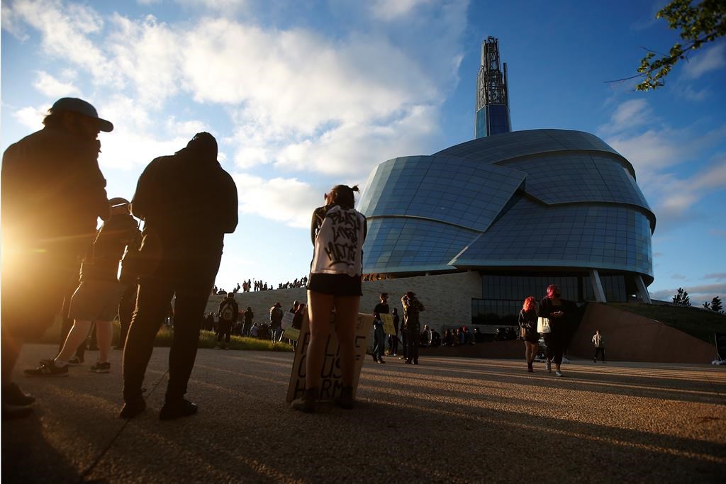 People gather in solidarity with the George Floyd protests across the United States at the Canadian Museum for Human Rights in Winnipeg, Friday, June 5, 2020.