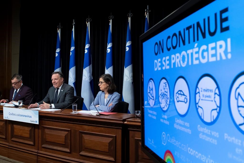 Quebec Premier Francois Legault, centre, Horacio Arruda, Quebec director of National Public Health, left, and Quebec Health Minister Danielle McCann during a news conference on the COVID-19 pandemic, Tuesday, June 9, 2020 at the legislature in Quebec City. THE CANADIAN PRESS/Jacques Boissinot.