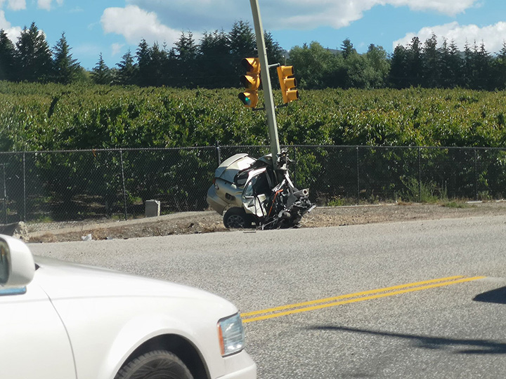 A photo showing half of a car after it hit a light pole in Kelowna on Thursday afternoon.