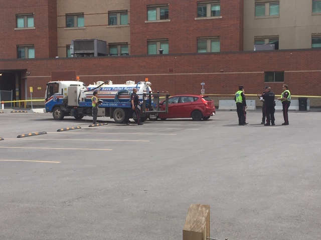 Calgary police on the scene of a crash involving a porta-potty truck in downtown Calgary.