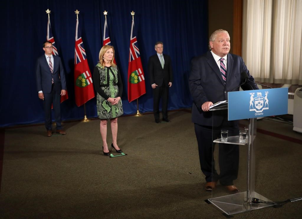 Ontario Premier Doug Ford holds his daily press conference at the Ontario Legislature at Queen's Park, Monday, June 22, 2020, joined by Christine Elliott, Deputy Premier and Minister of Health, Rod Phillips (right), Minister of Finance, and Monte McNaughton, (left) Minister of Labour, Training and Skills Development. THE CANADIAN PRESS/Richard Lautens -Pool.