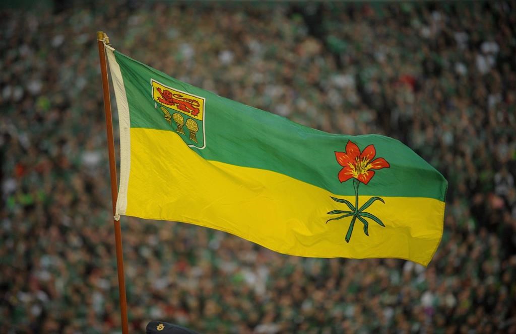 The Saskatchewan flag blows in the wind before the final Saskatchewan Roughriders game at Mosaic Stadium in Regina on Saturday, Oct. 29, 2016. The Saskatchewan government is extending services to youth who otherwise would be aging out of the foster care system. THE CANADIAN PRESS/Mark Taylor.