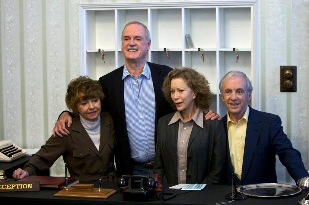 In this file photo dated Wednesday, May 6, 2009, the cast of ‘Fawlty Towers’ (from left) Prunella Scales, John Cleese, Connie Booth and Andrew Sachs reunite to celebrate the 30th anniversary of the TV show and mark a special program ‘Fawlty Towers: Reopened’ at The Naval and Military Club, London, England.