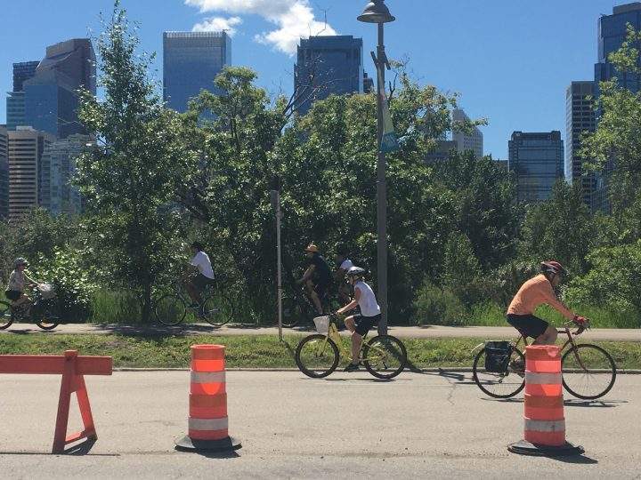 Cyclists use Memorial Drive adaptive road way and pathway. 