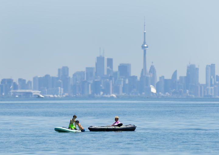 People enjoy activities on Lake Ontario overlooking the City of Toronto skyline during the COVID-19 pandemic at Jack Darling Park in Mississauga on Wednesday, June 17, 2020. 