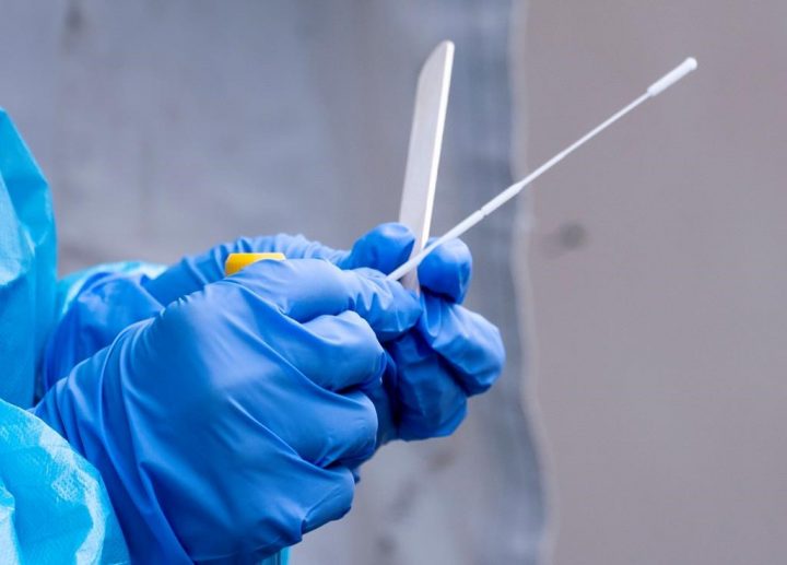 A nurse gets a swab ready at a temporary COVID-19 test clinic in Montreal, on Friday, May 15, 2020.