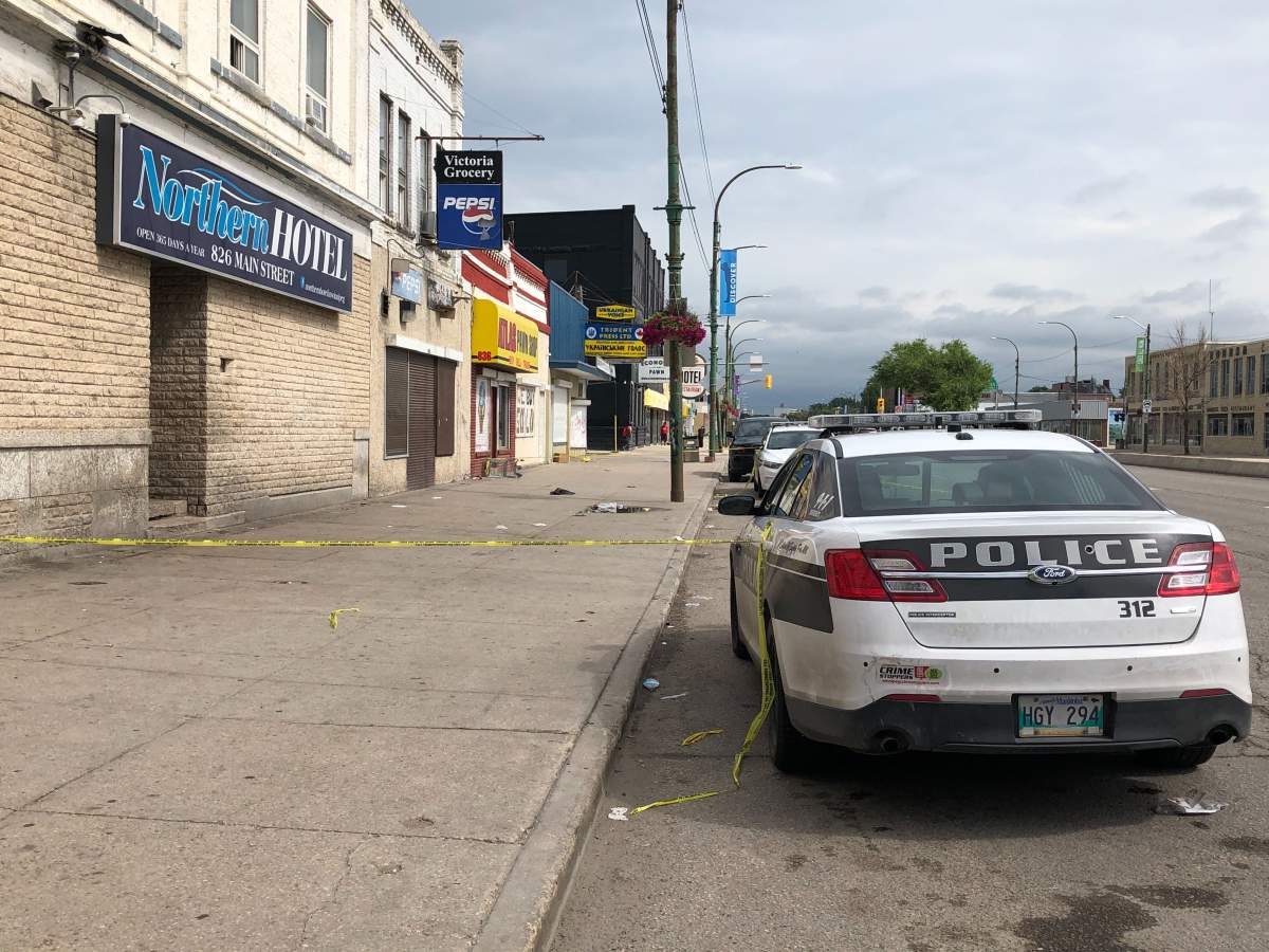 Winnipeg police on Main Street investigating the city's latest homicide. 
