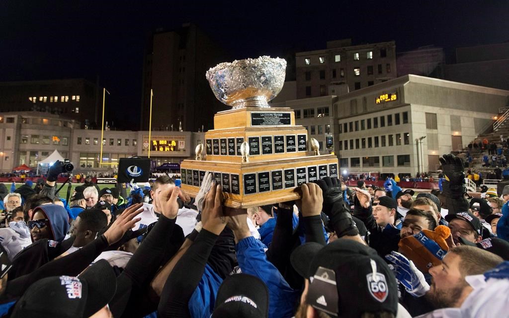 Players from the Montreal Carabins hoist the Vanier Cup after beating the McMaster Marauders in the CIS football final in Montreal on November 29, 2014. Dozens of Canadian football players dreaming of hoisting the Vanier Cup in their fifth and final year of university eligibility have had those hopes dashed. The cancellation of the 2020 national football championship game because of COVID-19 and U Sports not altering an age eligibility rule accelerates the swan song of roughly 300 football players. THE CANADIAN PRESS/Graham Hughes.