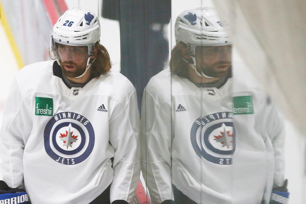 Winnipeg Jets' Blake Wheeler (26) looks on during the first day of the Jets NHL summer training camp as the NHL reopens during COVID-19 in Winnipeg, Monday, July 13, 2020.