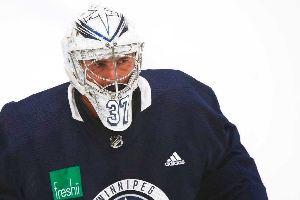Winnipeg Jets goaltender Connor Hellebuyck (37) at practice during their NHL summer training camp.